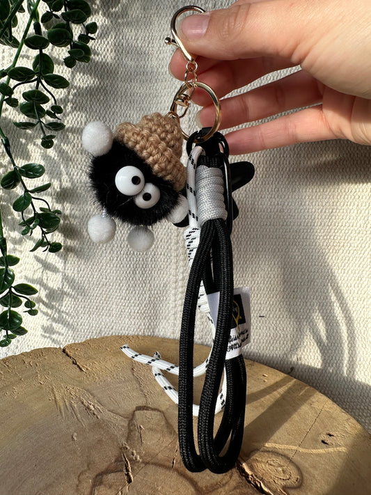 Schwarzes Knäul mit Stern - Schlüsselanhänger